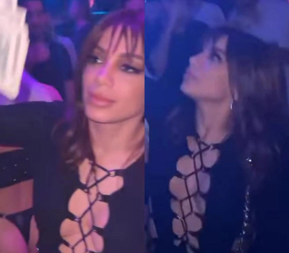 Anitta joga dinheiro para o alto em boate.